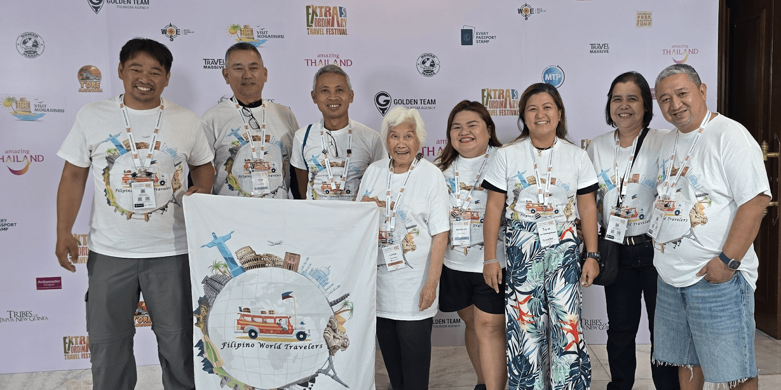 "Filipino World Travelers group at a travel event, showcasing a community committed to global exploration and Filipino pride."
