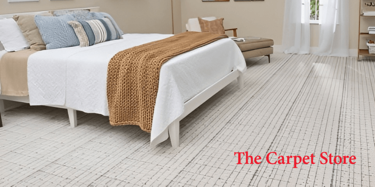 Modern bedroom with textured white carpet and neutral decor by The Carpet Store.