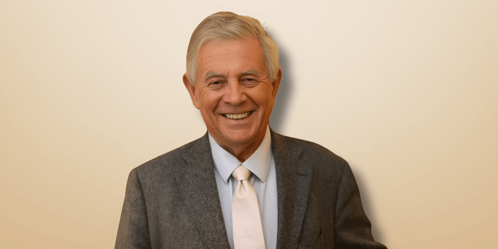 Here's an alt text based on the article: "Mark Ellis, author of the Frank Merlin crime series, smiling in a professional portrait."