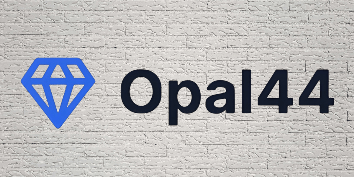 Opal44 logo on white brick wall background