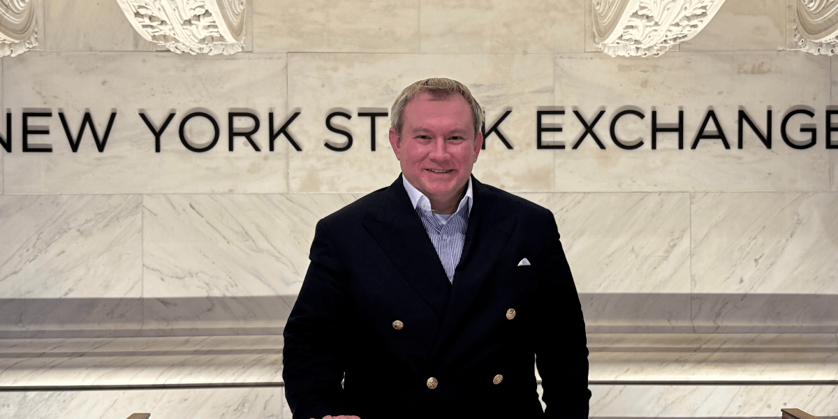 "Joshua Sodaitis, CEO of Peer To Peer Network, at the New York Stock Exchange, showcasing leadership in digital business cards."