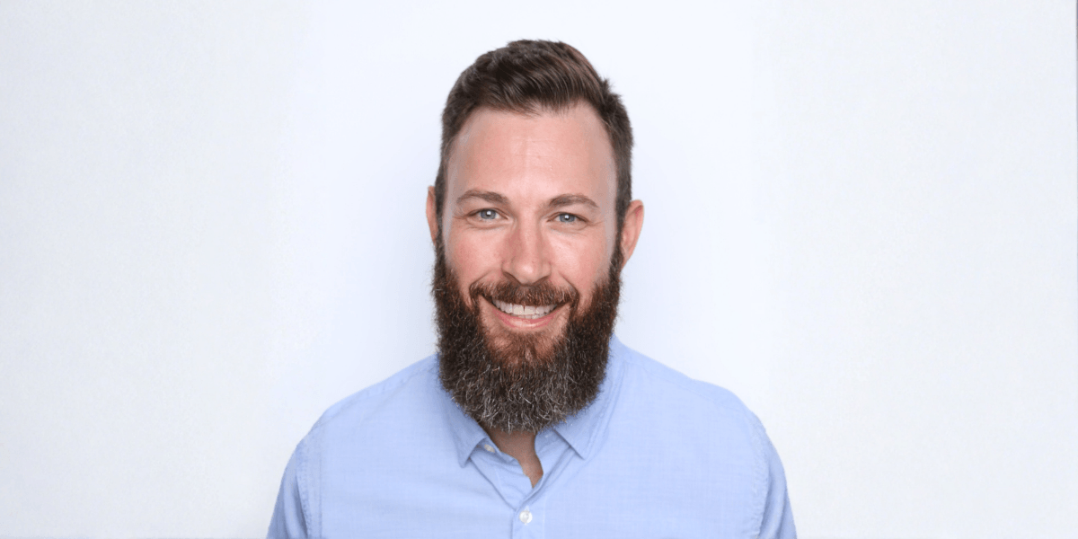 "Justin Currie, CEO of Masters of Home Care, smiling confidently, representing leadership, mentorship, and scalable home care business success."