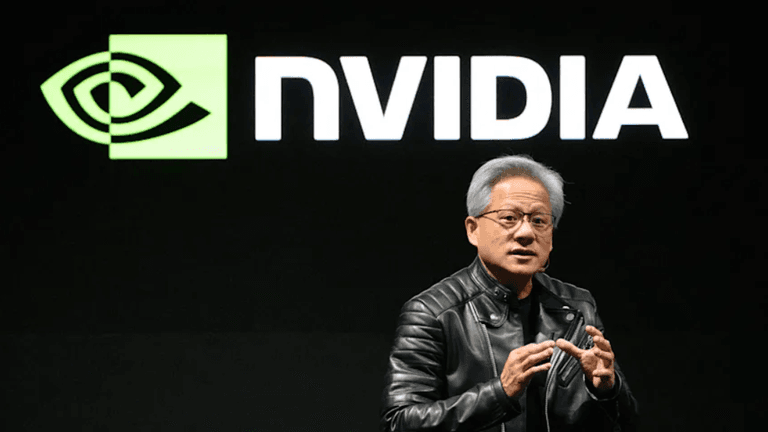 A speaker in a black leather jacket presents in front of an NVIDIA logo