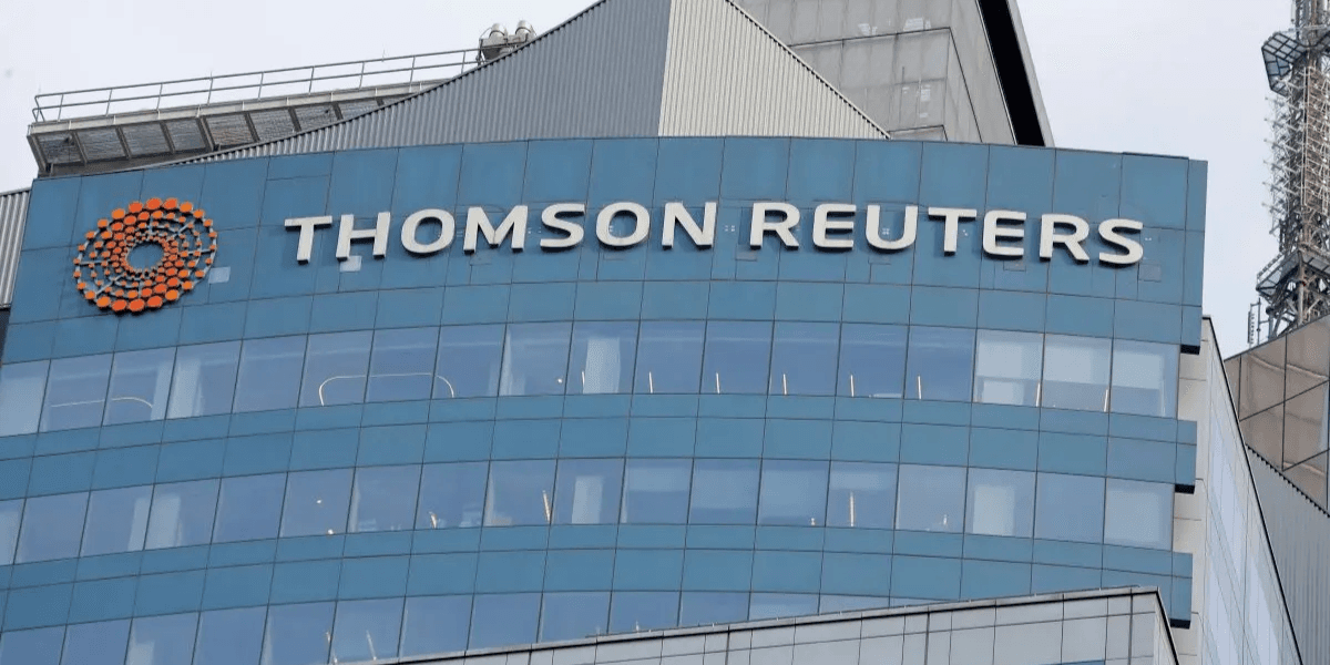 Signage of Thomson Reuters on a modern glass building exterior