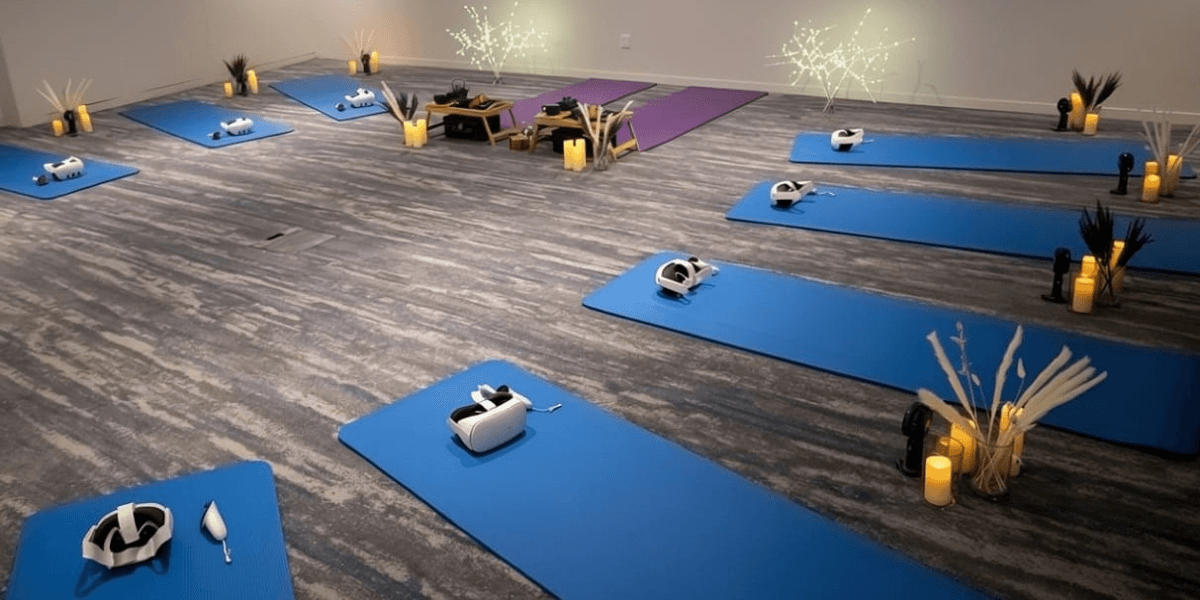 VR headsets placed on yoga mats for a corporate mindfulness session.