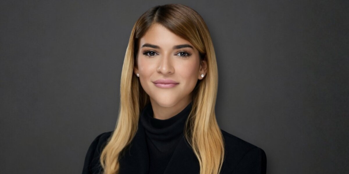 Veronica Yazmin Rivera, a woman with long blonde hair in a black top, focuses on bridging strategy and execution for businesses.