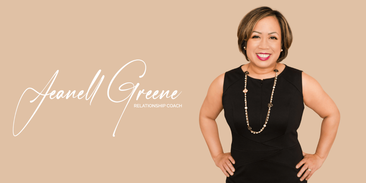 Jeanell Greene, Relationship Coach, smiling confidently in a black dress.