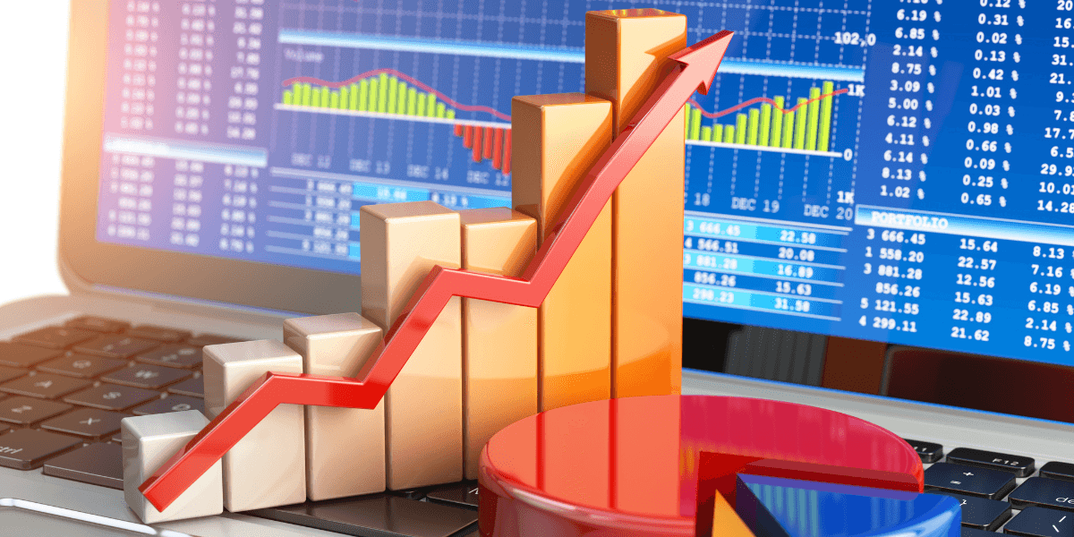 Rising financial chart and arrow displayed against stock market data on a laptop screen.