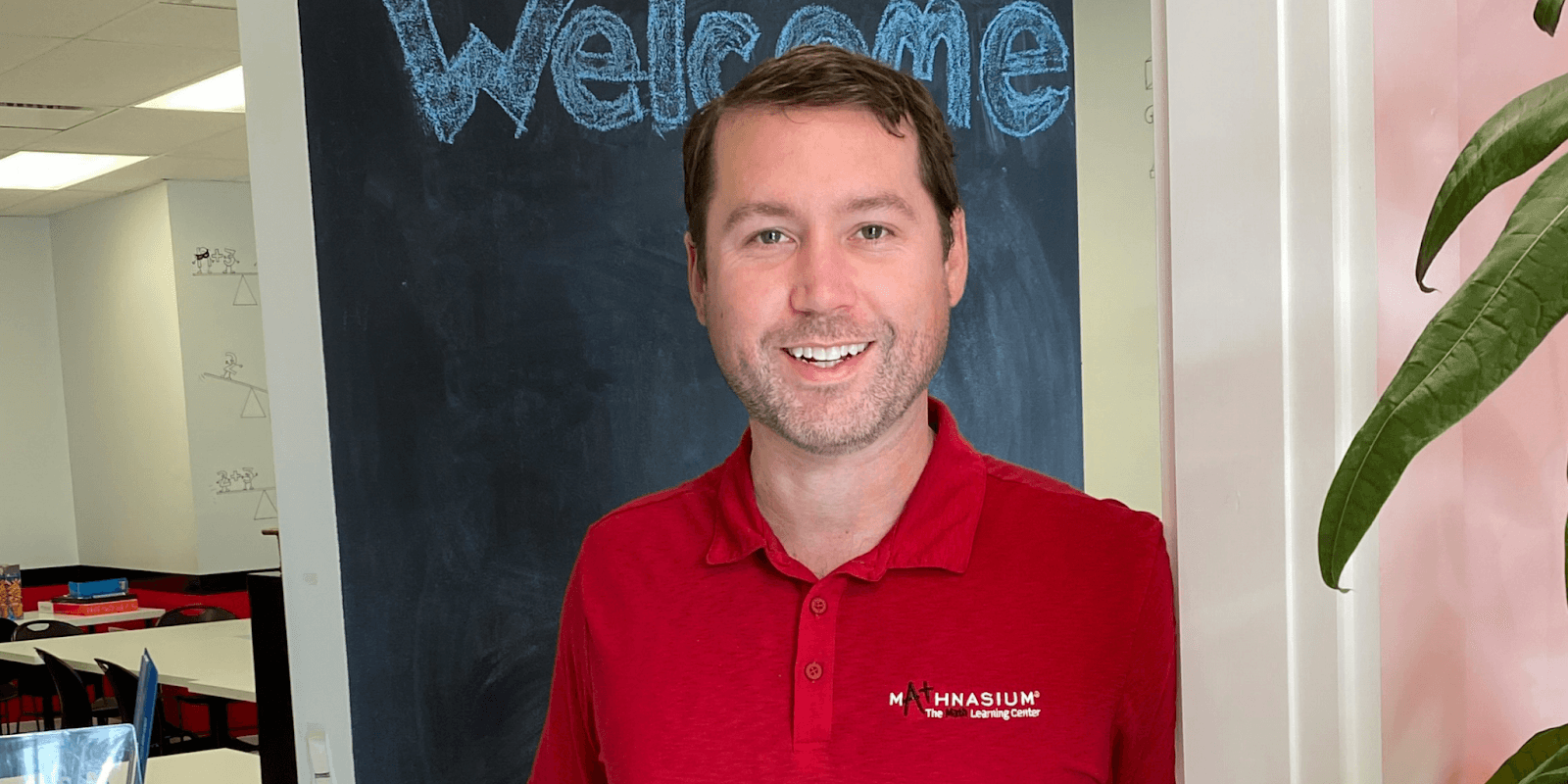 Ryan Costa, owner of Mathnasium of Portsmouth, working with a student in a focused, supportive learning environment, highlighting his commitment to personalized math instruction and building student confidence.