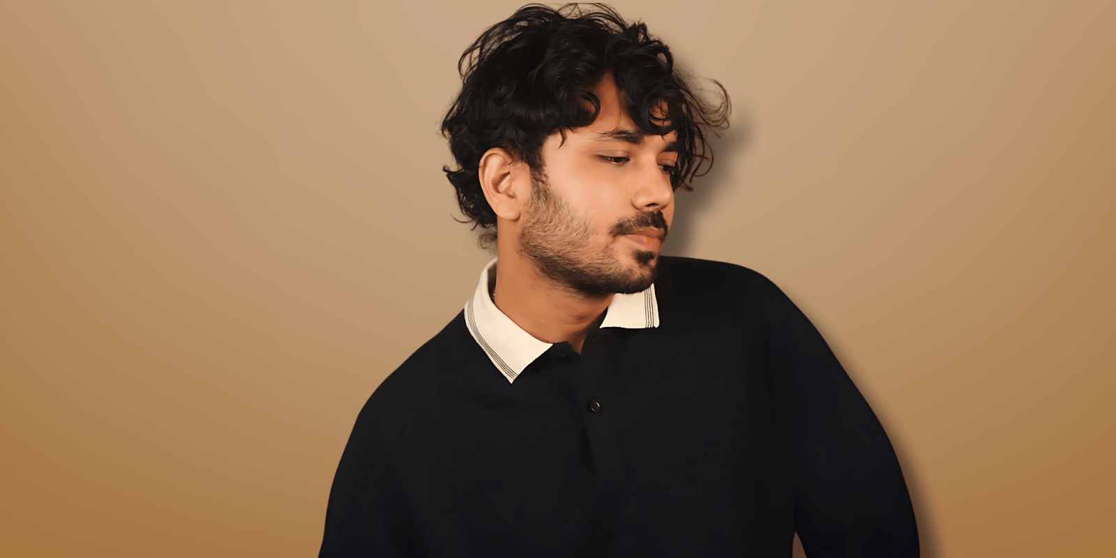 Akash KS, a leader focused on global peace and diplomacy, poses with a thoughtful expression against a neutral background.