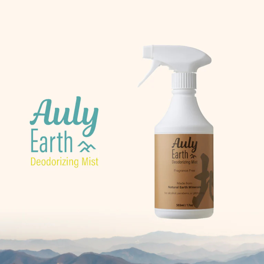Auly Earth Deodorizing Mist fragrance-free spray bottle with a clean, minimalistic label, made from natural earth minerals, positioned against a light, soft background with mountain visuals.