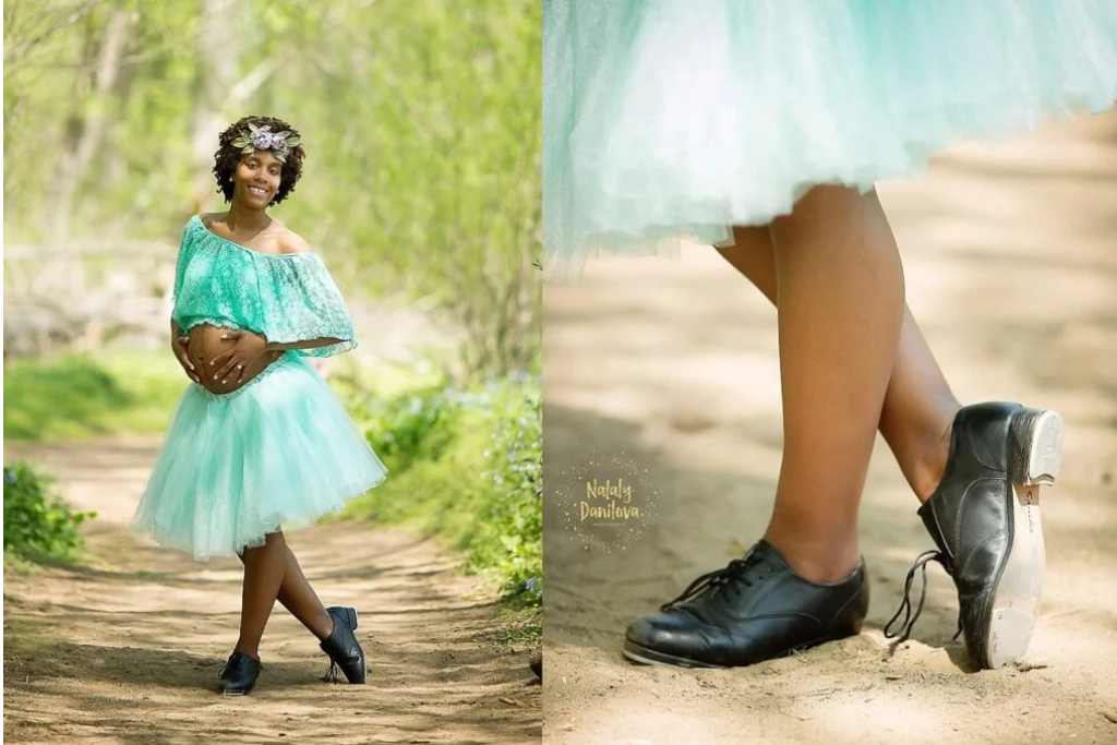 "Pregnant woman in a mint-green tulle skirt and off-shoulder top, standing in a forest path while smiling, with a close-up of her black tap shoes, capturing a joyful maternity moment."