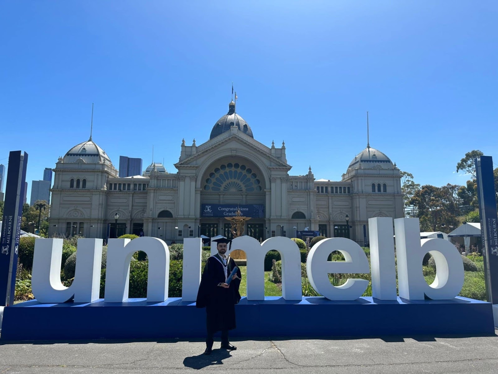 Alfred Abou Eissa at the University of Melbourne graduation, reflecting a journey from war-torn beginnings to global influence.