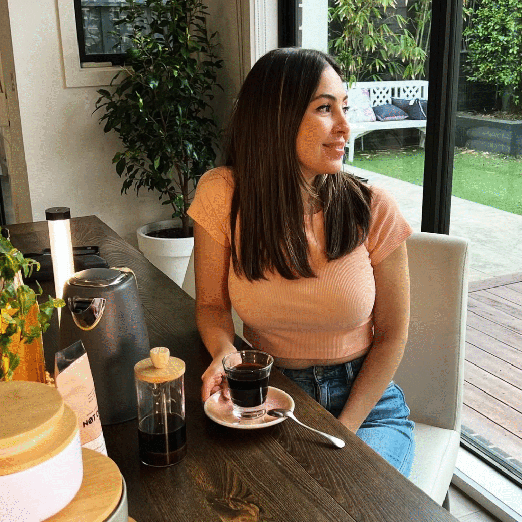 Sila Gatti, founder of Not Coffee, holding a cup of her caffeine-free alternative, reflecting the brand’s health-conscious mission.