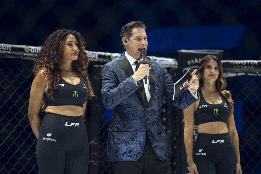 Chad Fishburne, dynamic ring announcer, energizing combat sports events with his signature catchphrase, ‘It’s time for this crowd to get loud!