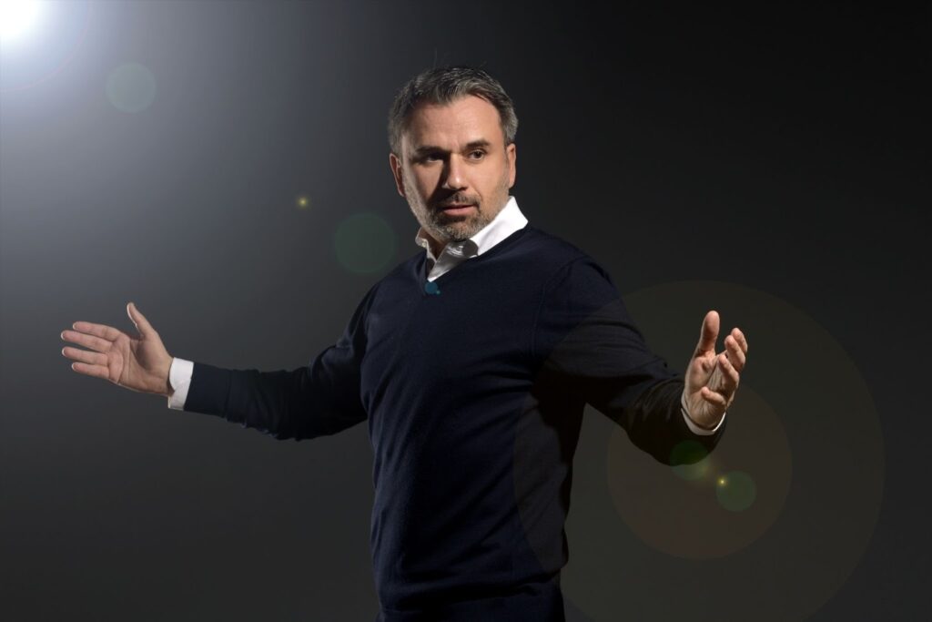 Leader in dynamic pose, showcasing trust's importance in negotiations and organizational success by 2026.