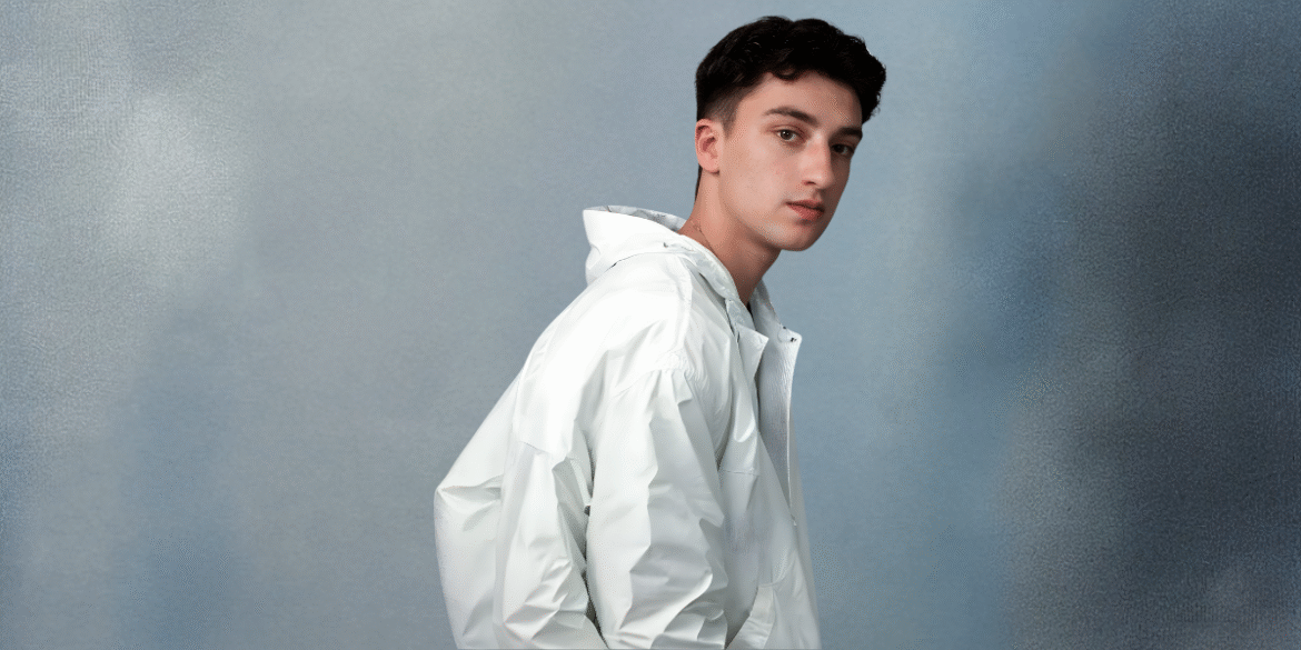 Anton Zalis speaking on stage about merging creativity and AI to craft smarter digital products with Improvs.com.