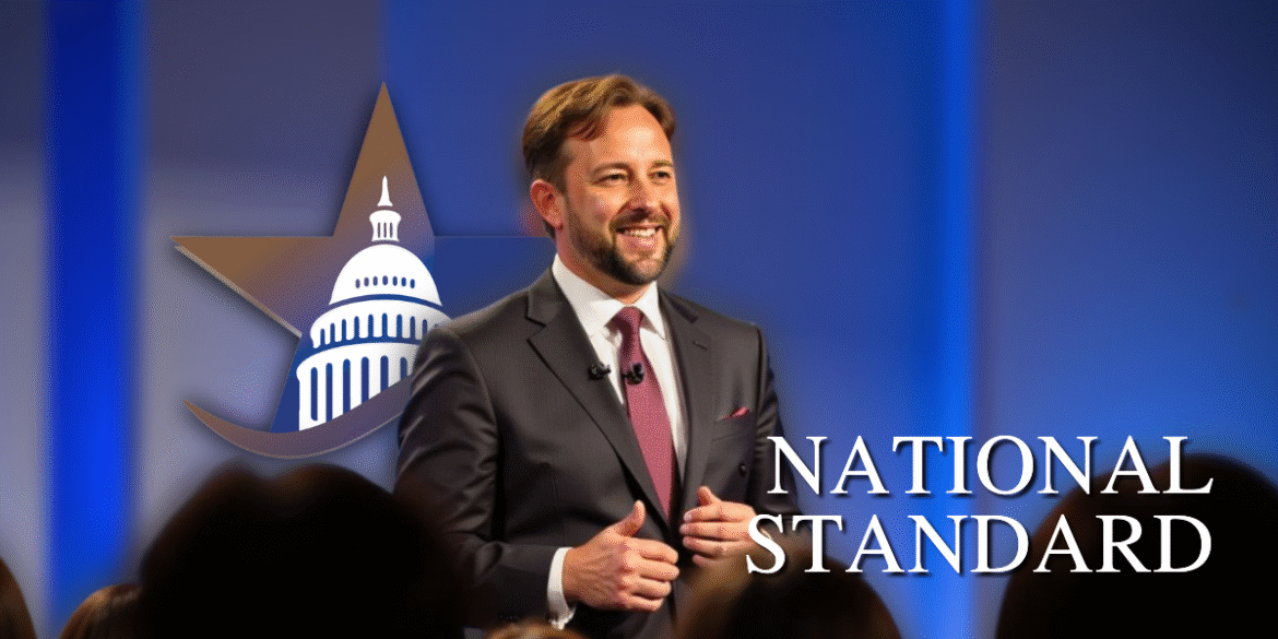 "Russell Duke, President and CEO of National Standard Finance, speaking at a conference, leading infrastructure finance and development."