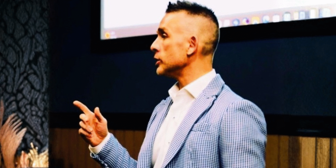 Dr. Pat™ speaking at a financial planning seminar, emphasizing his approach to excellence and transparency.