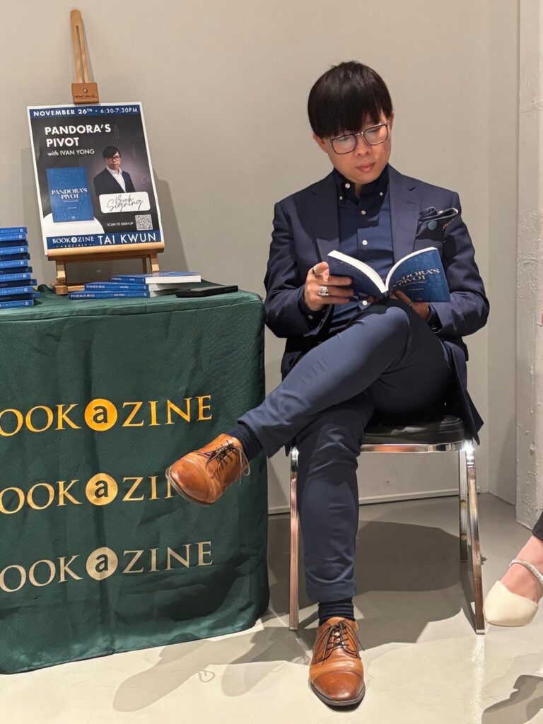 Ivan Yong reading from Pandora’s Pivot at a book signing event.