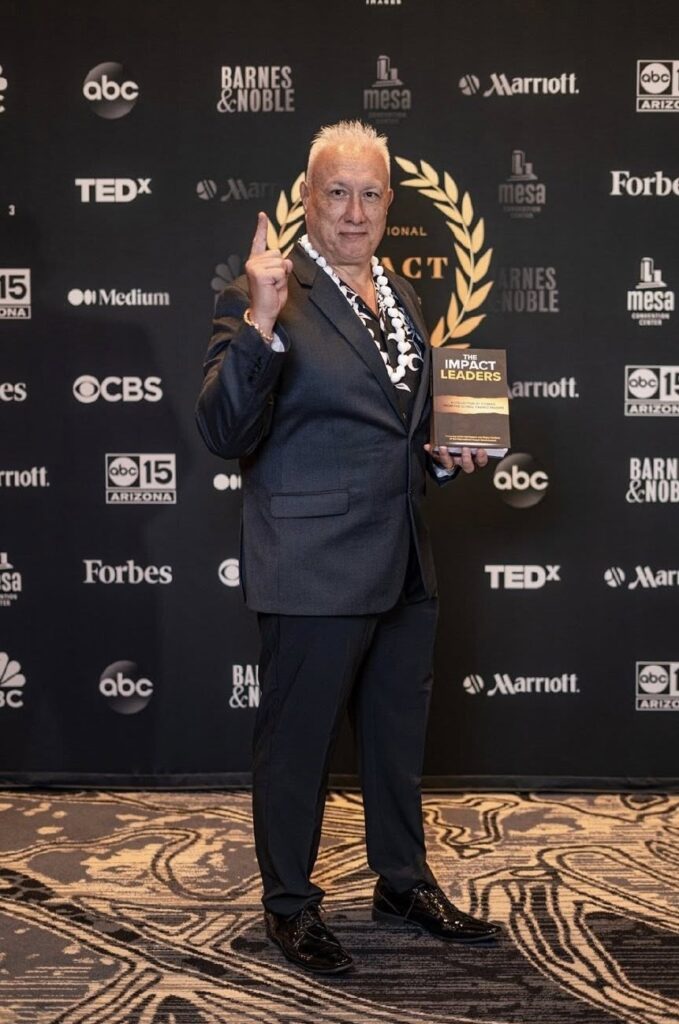 "Apostle Constantine I. Nightingdale holding an award at a global leadership event."