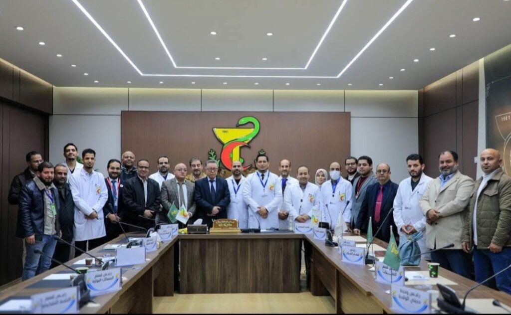 Medical and administrative staff at Ibn Sina Teaching Hospital, Sirte, celebrating healthcare progress and national development milestones.