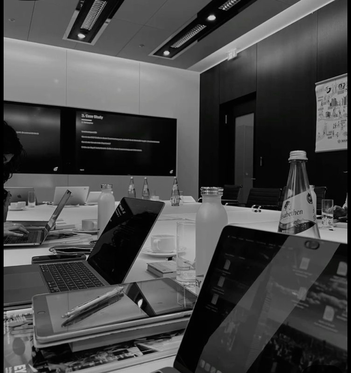 A professional meeting room setup during a crisis management strategy session.