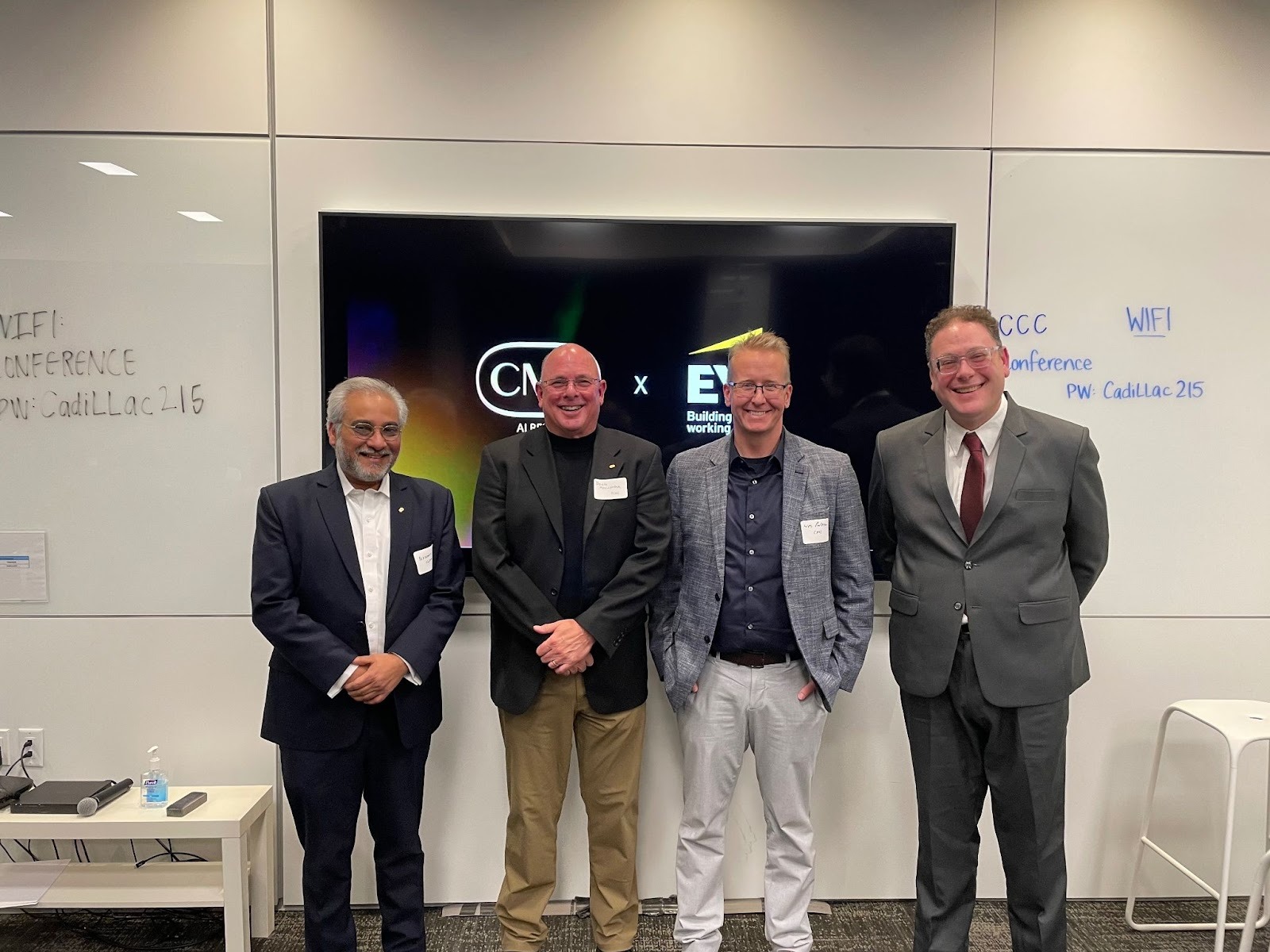 Wesley Paterson with colleagues at an event, showcasing collaborative leadership and corporate transformation.