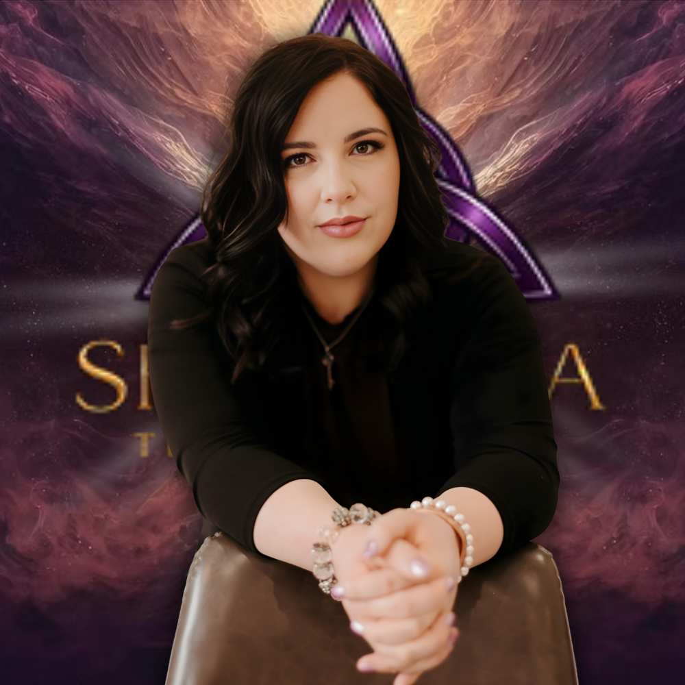 Shantana Telise seated, offering a focused and empowering presence in her spiritual space.