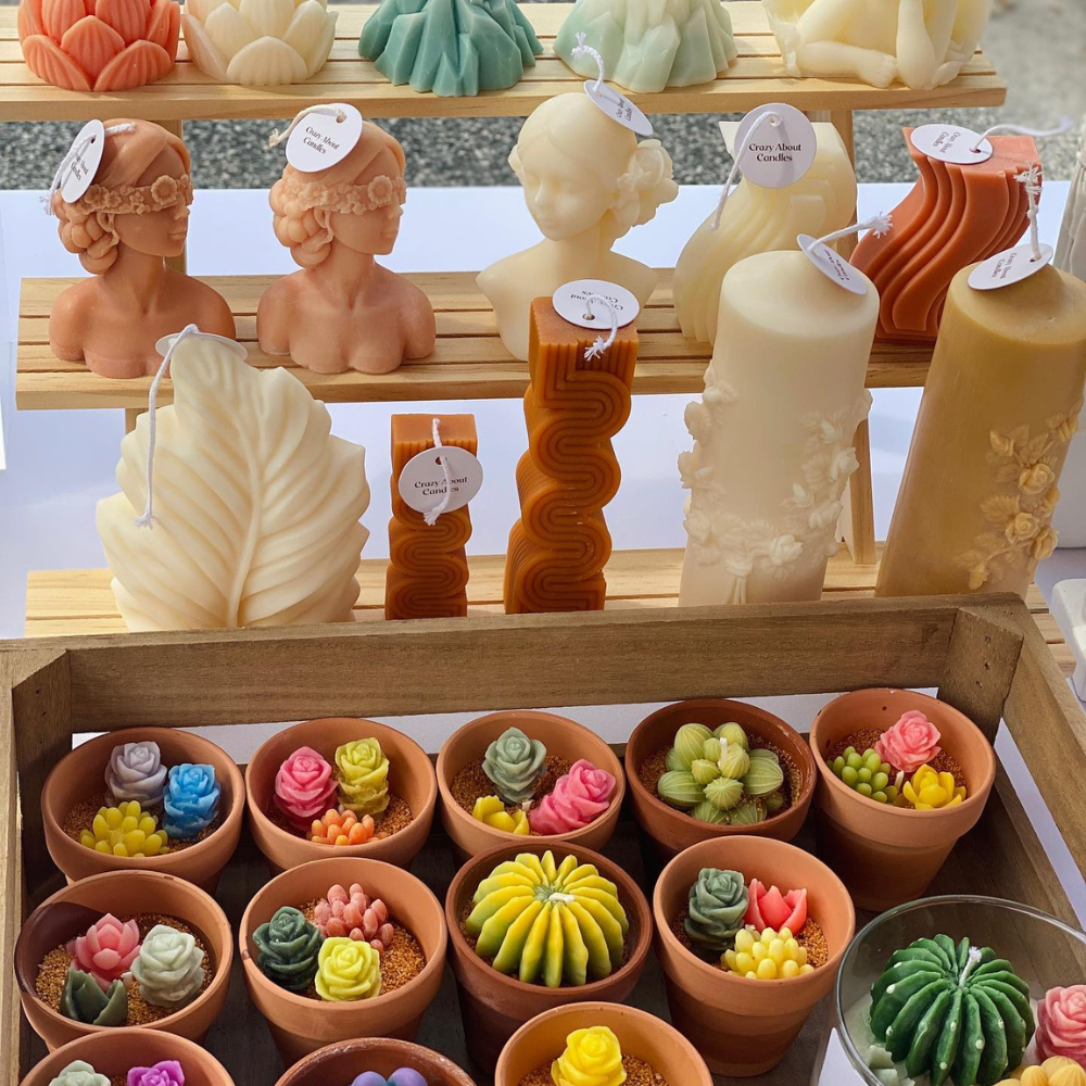 Handcrafted candles in unique shapes and vibrant colors from Crazy About Candles.