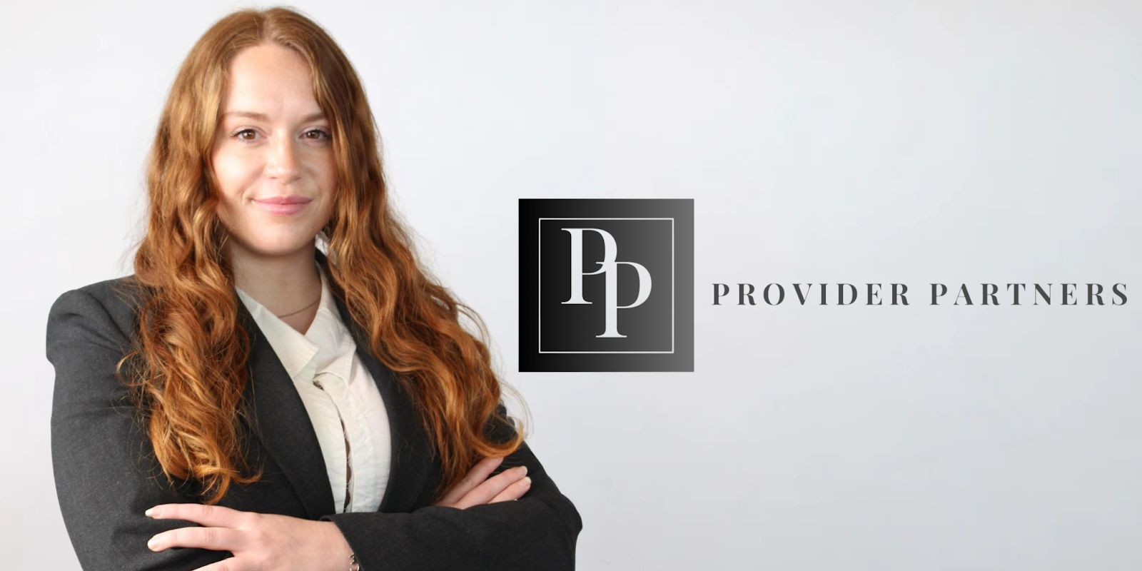 Woman standing with arms crossed next to the Provider Partners logo, wearing a dark blazer and white blouse.