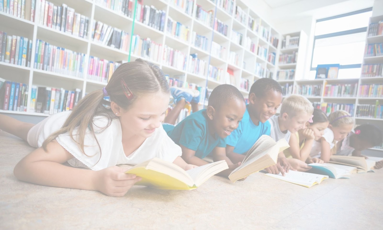Diverse group of children reading together on a library floor, reflecting inclusive emotional learning.