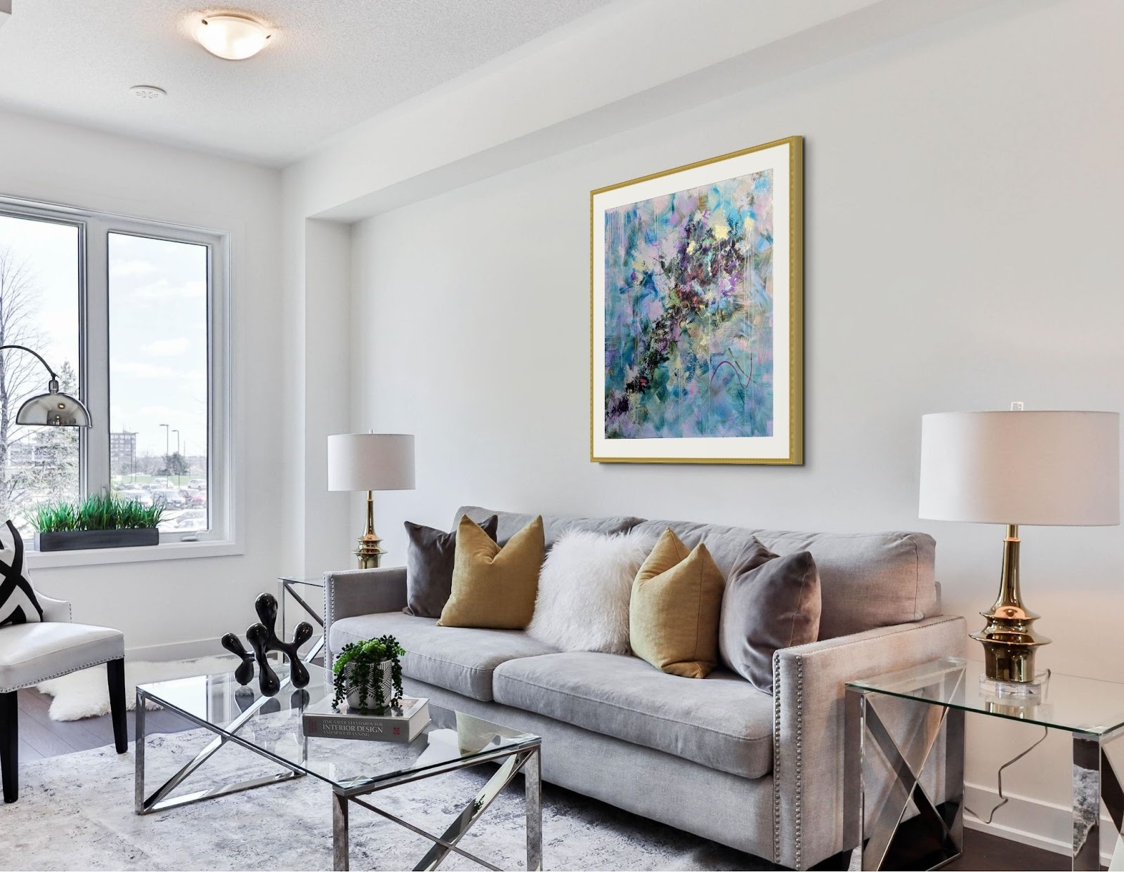 A colorful abstract painting by Lisa Wommack displayed in a modern living room.