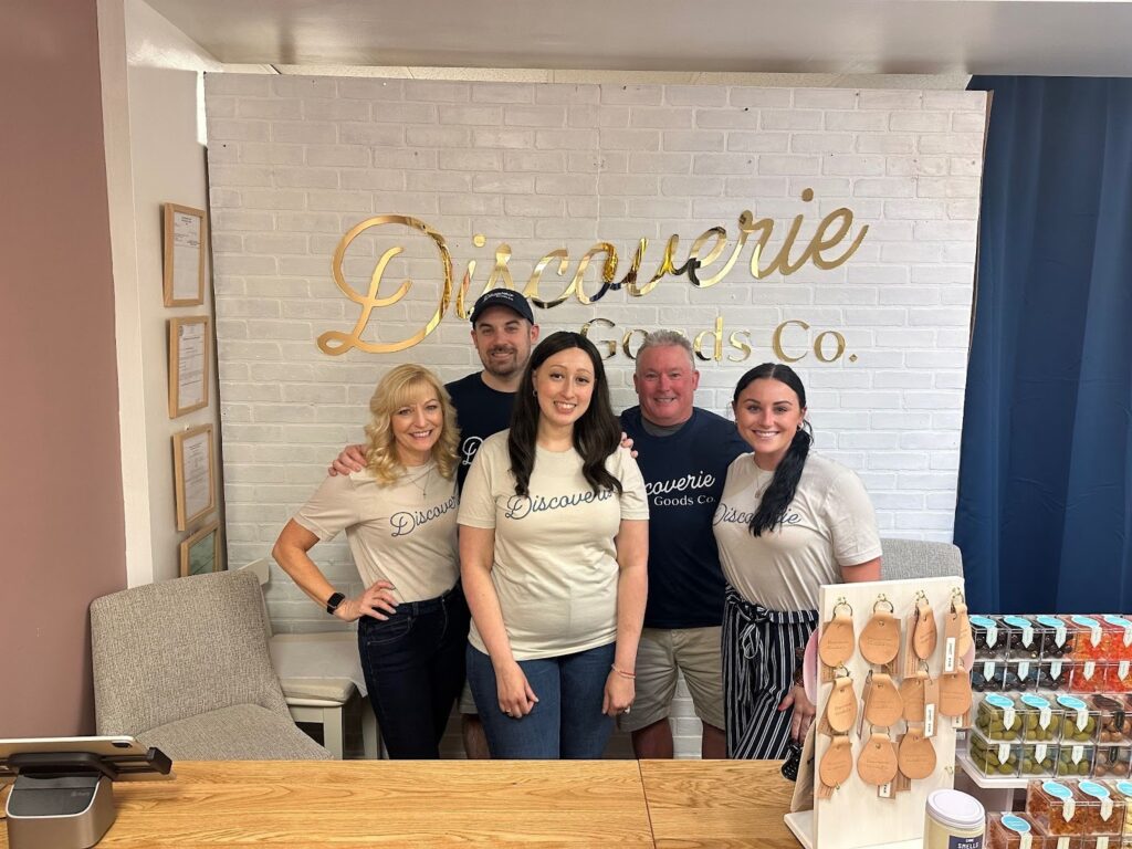 The Ducourie's Coffee Co. team poses in their café, radiating warmth and enthusiasm for their coffee and local culture.
