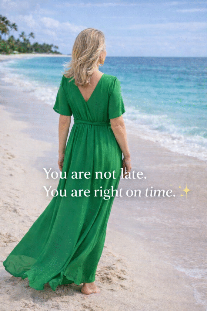Woman in flowing green dress walking along tropical beach, text overlay: You are not late. You are right on time.