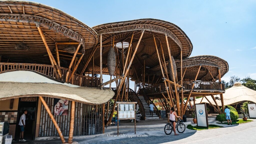 Bamboo house in Bali, Indonesia, surrounded by lush greenery, showcasing traditional architecture and tropical ambiance.