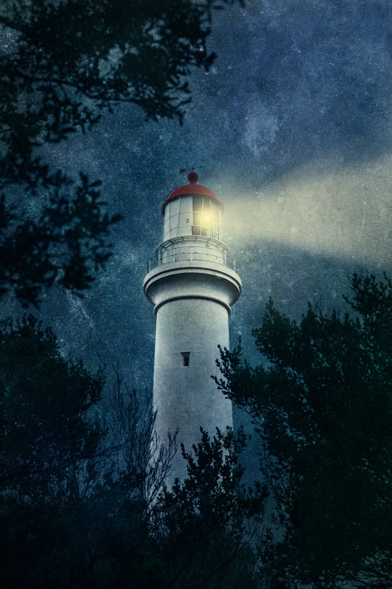 Lighthouse beam shining through misty night sky, surrounded by dark trees, creating calm, introspective atmosphere.