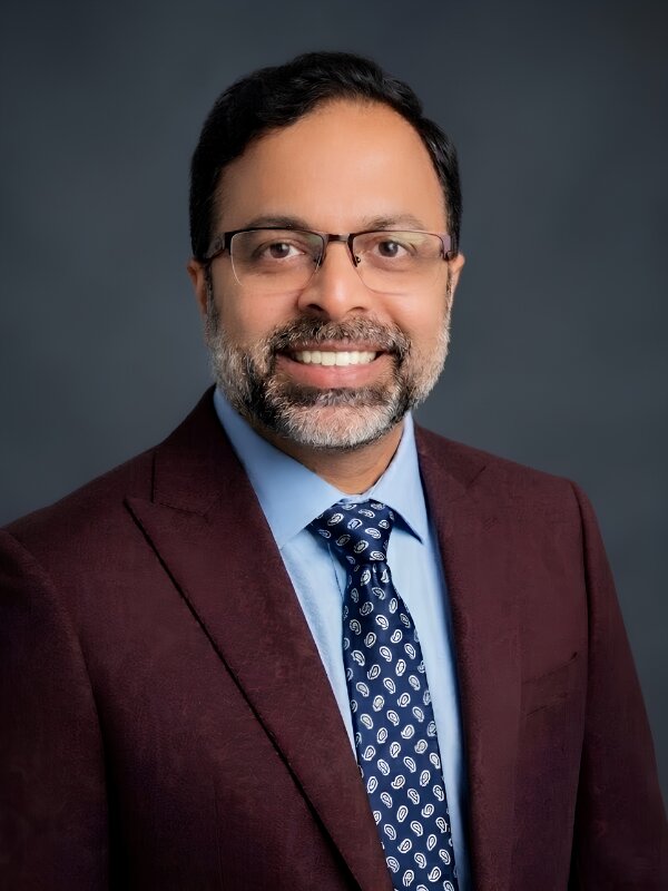 Professional headshot of Dr. Purnank Gandhi, GapRx 340B Consultants LLC, wearing glasses and business attire.