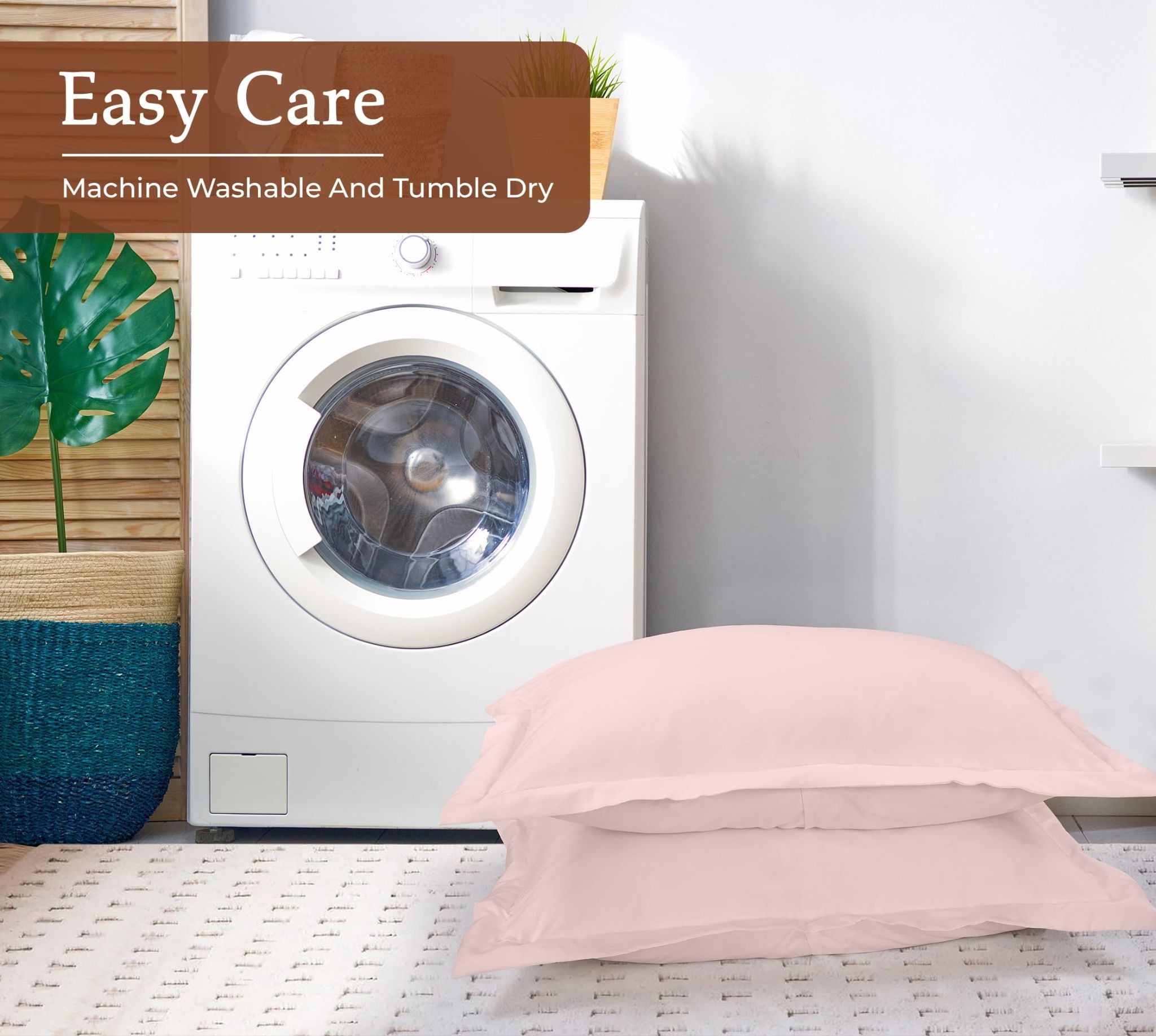 Washing machine with a "Easy Care" sign above; next to it are two pink pillows on a patterned rug, evoking a clean and cozy atmosphere.