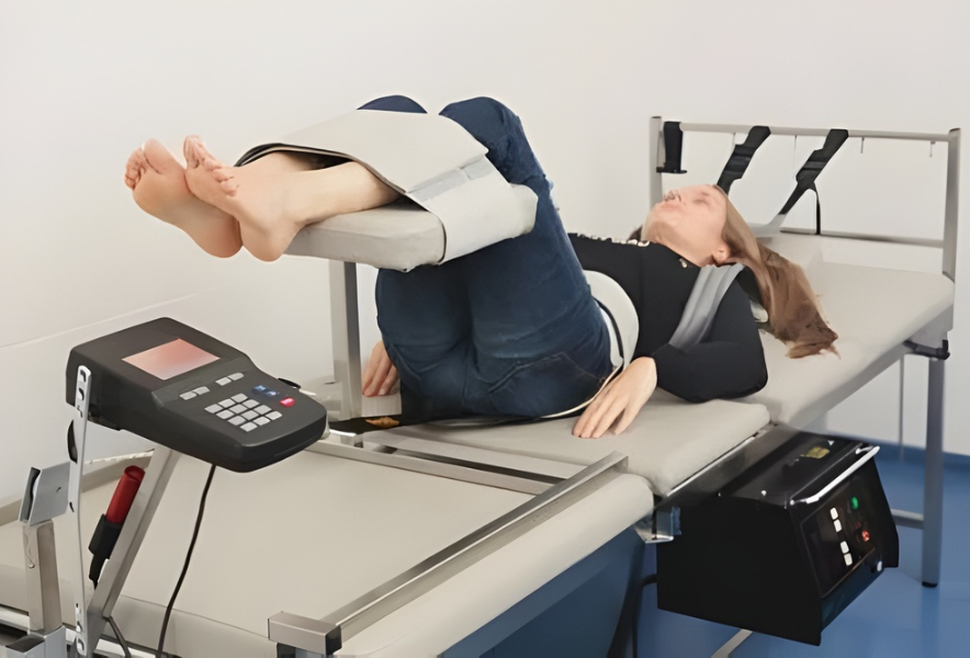 Patient undergoing spinal decompression therapy at chiropractic rehabilitation clinic.