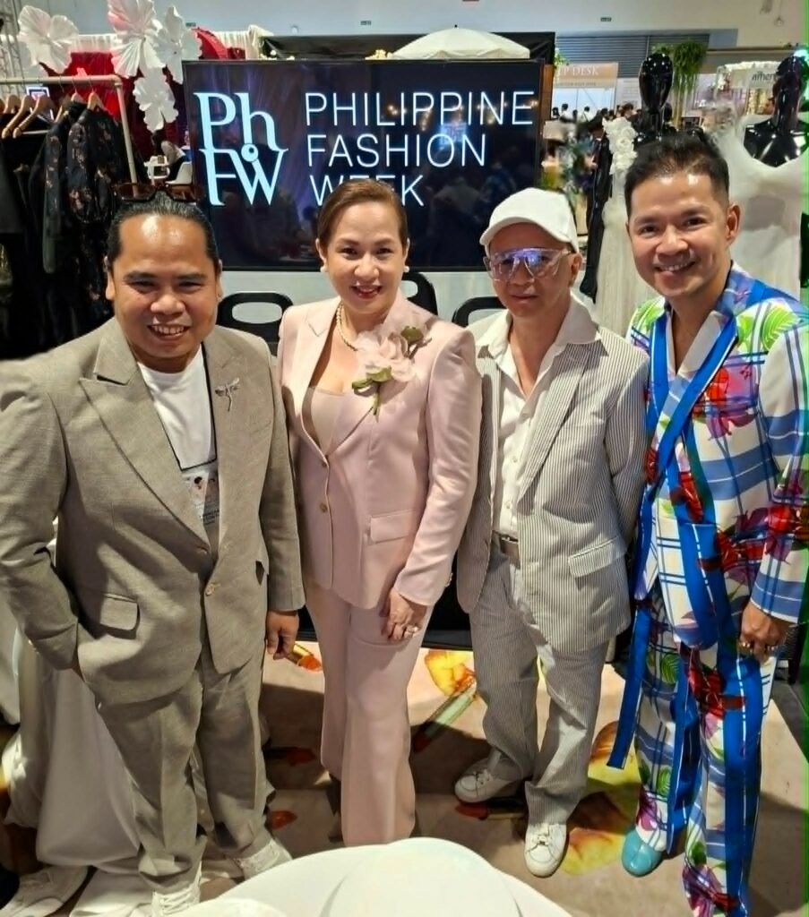 Sharon P. Fabian with designers at Philippine Fashion Week event.