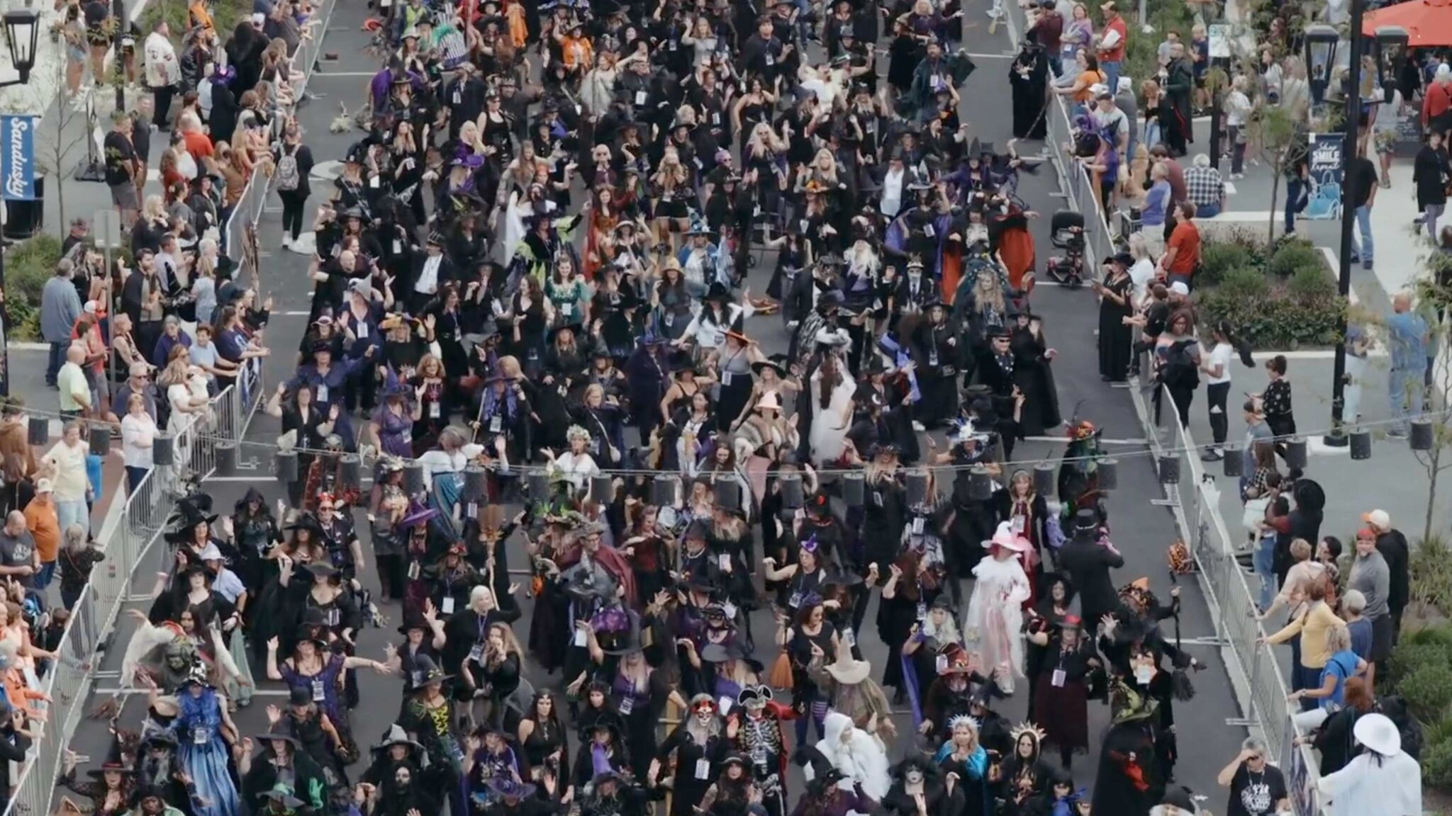 Hundreds of costumed witches fill downtown streets during the Sandusky Witches Walk parade and community celebration.
