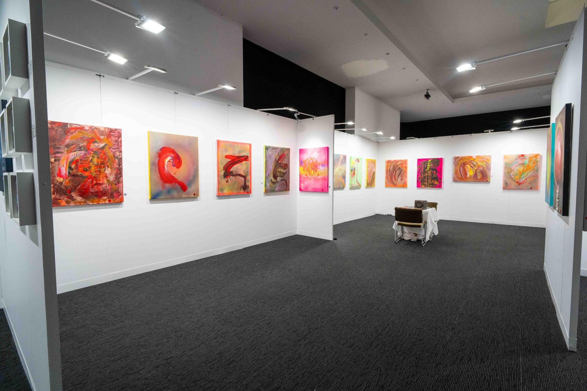 Gallery exhibition showcasing Marc Noël’s colorful multidimensional quantum paintings on display.