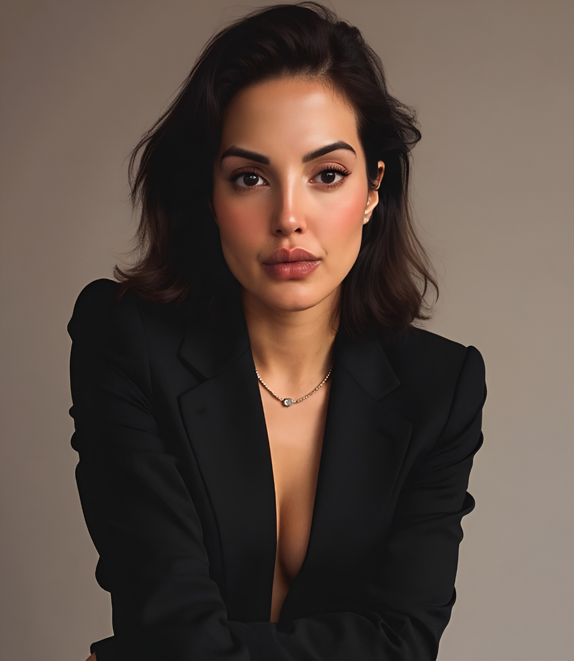 Professional portrait of a woman in a black blazer looking confidently at the camera.