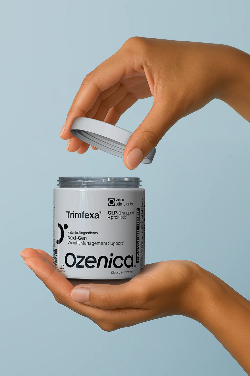 Hands opening an Ozenica supplement container, highlighting accessibility and daily wellness use.