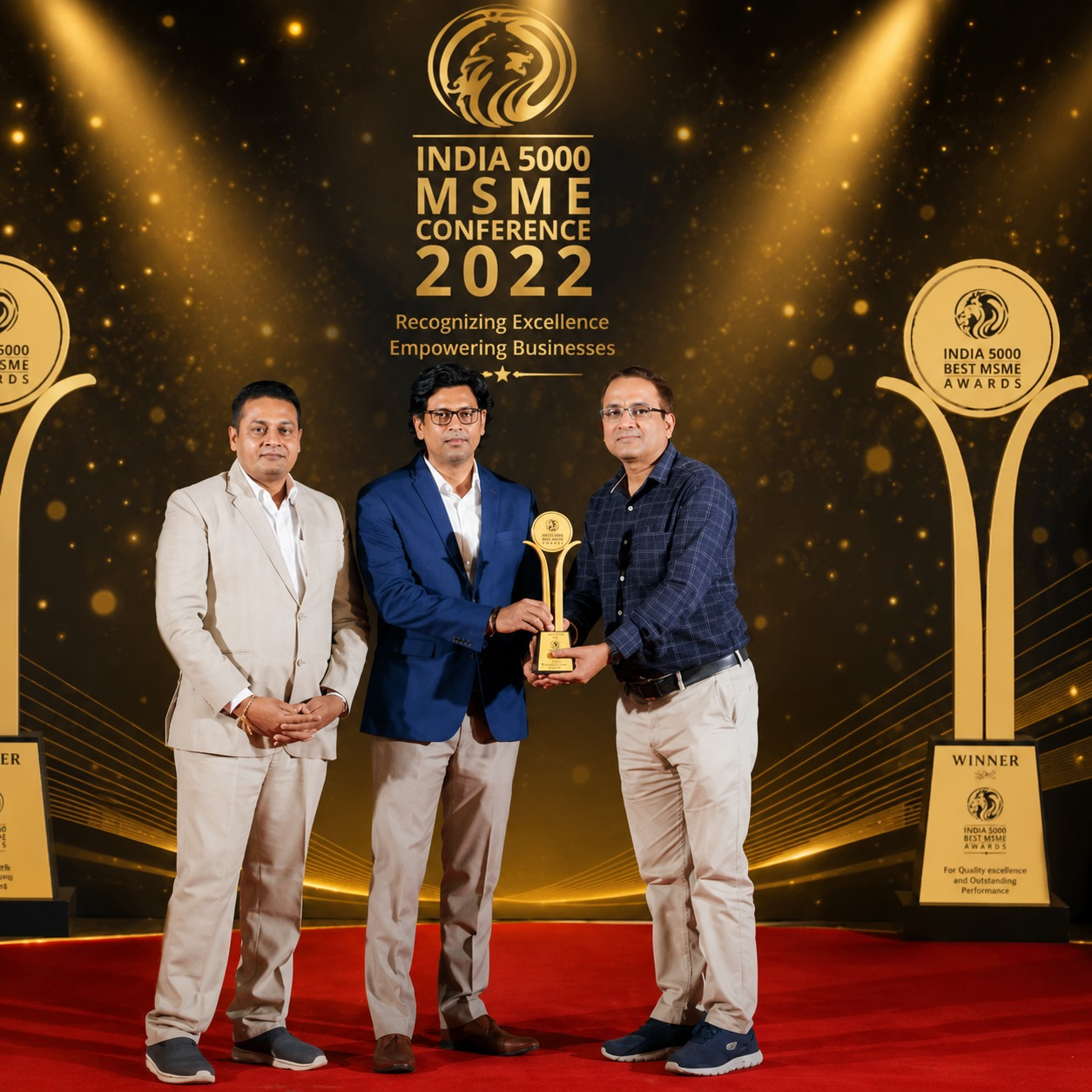 Dr. Neeraj Kumar receiving the India 500 Best MSME Award at a national business conference.